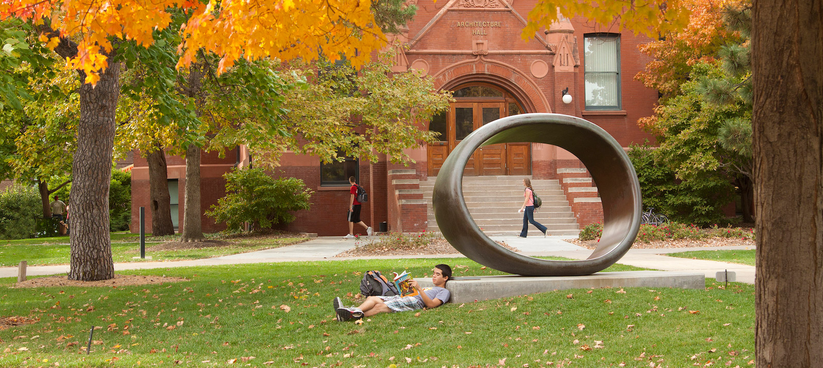 student relaxing in the grass